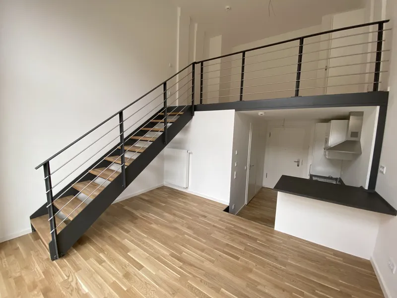 Architektonisches Highlight: 1,5-Zimmer-Wohnung mit Galerie und EBK — photo 1